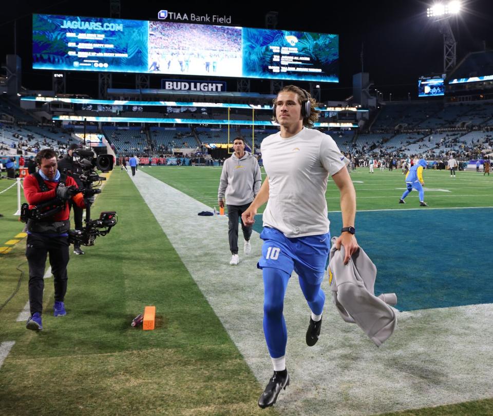 Chargers quarterback Justin Herbert heads to the locker room after warmups before an AFC wild-card game at Jacksonville.