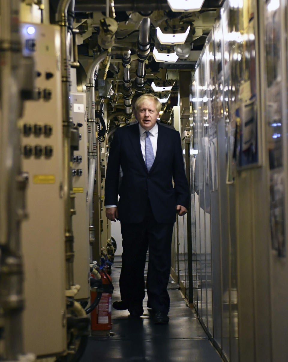 CORRECTING NAME OF BOAT TO HMS VICTORIOUS - Britain's Prime Minister Boris Johnson tours the nuclear submarine HMS Victorious during his visit to the Naval Base in Faslane, Scotland, Monday July 29, 2019. Johnson is expected to announce Monday a 300 million-pound (dollars 371 million US) funding boost to help drive economic growth in Scotland, Wales and Northern Ireland. (Jeff J Mitchell / Pool via AP)