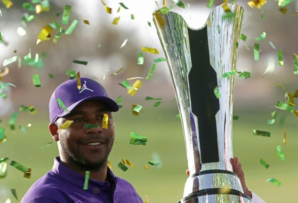 Harold Varner III is presented the trophy after winning the PIF Saudi International at Royal Greens Golf in King Abdullah Economic City, north of Saudi Arabia’s Red Sea coastal city of Jeddah, on February 6, 2022. (Photo by Fayez Nureldine / AFP via Getty Images)