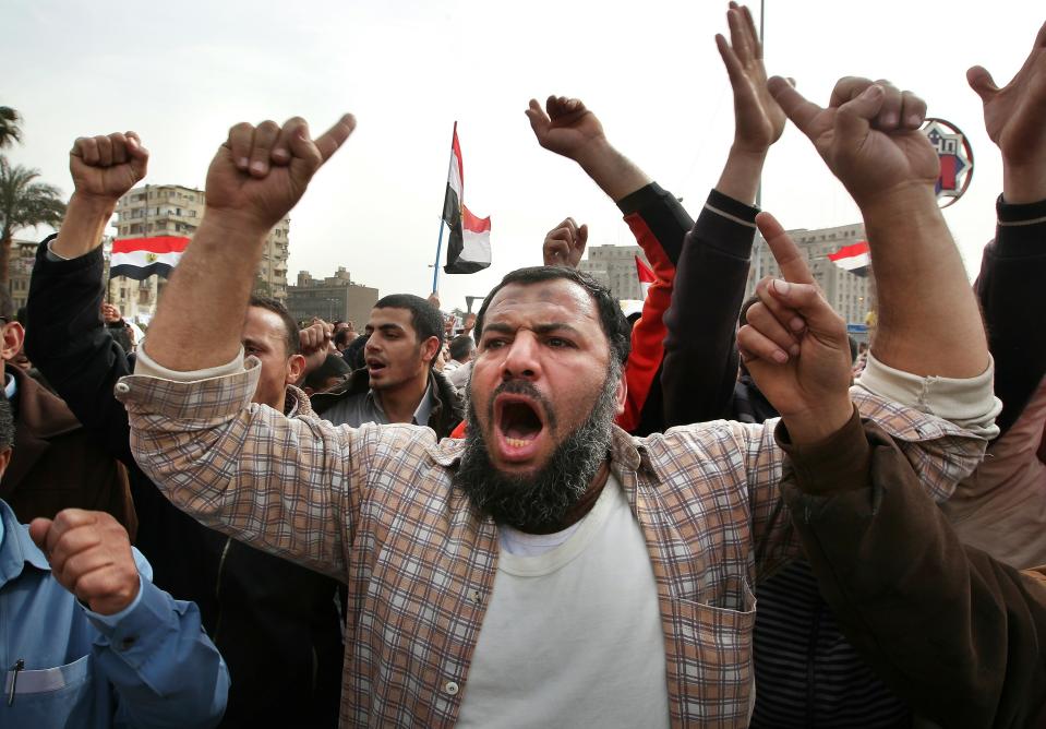 CAIRO, EGYPT - FEBRUARY 04: Anti-government demonstrators chant in Tahrir Square on February 4, 2011 in Cairo, Egypt. Anti-government protesters have called today 'The day of departure'. Thousands have again gathered in Tahrir Square calling for Egyptian President Hosni Mubarak to step down. (Photo by Peter Macdiarmid/Getty Images)