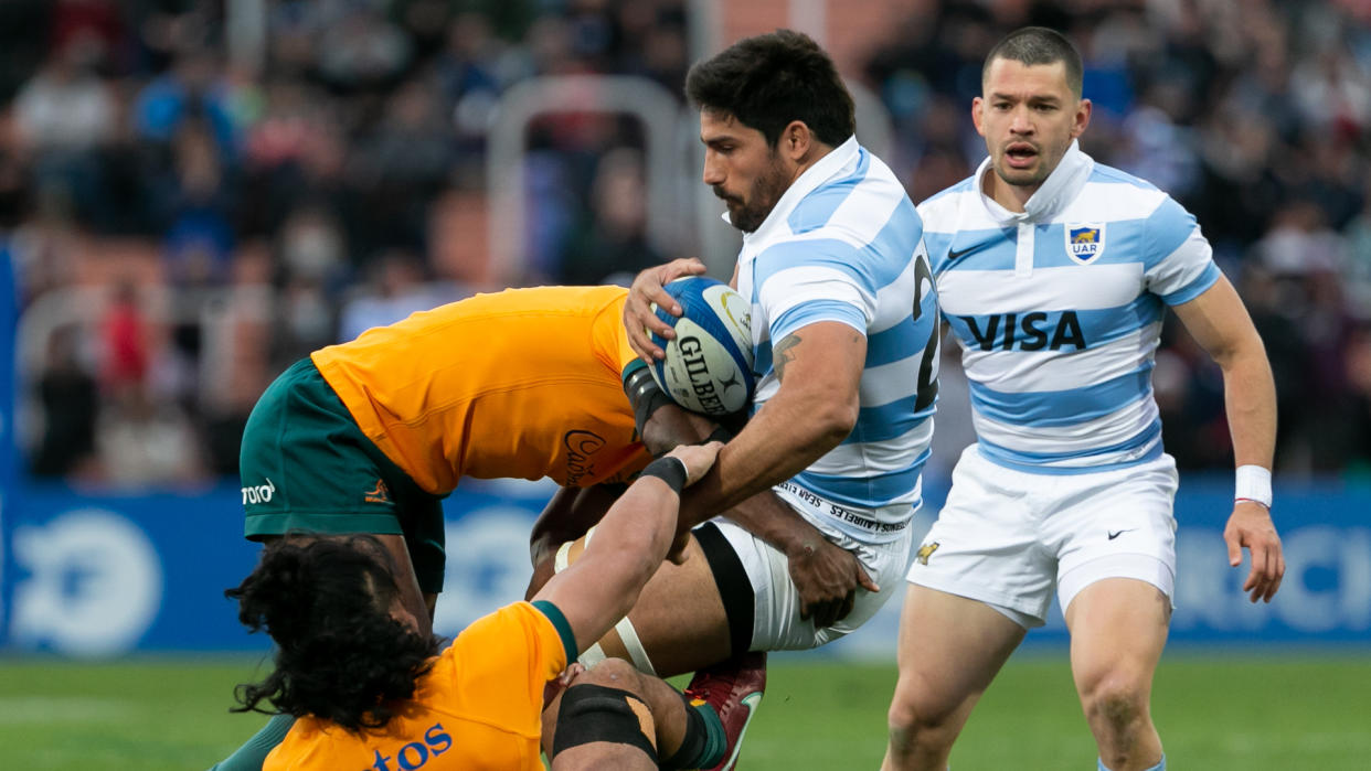  Rodrigo Bruni of Argentina is tackled by Len Ikitau of Australia 