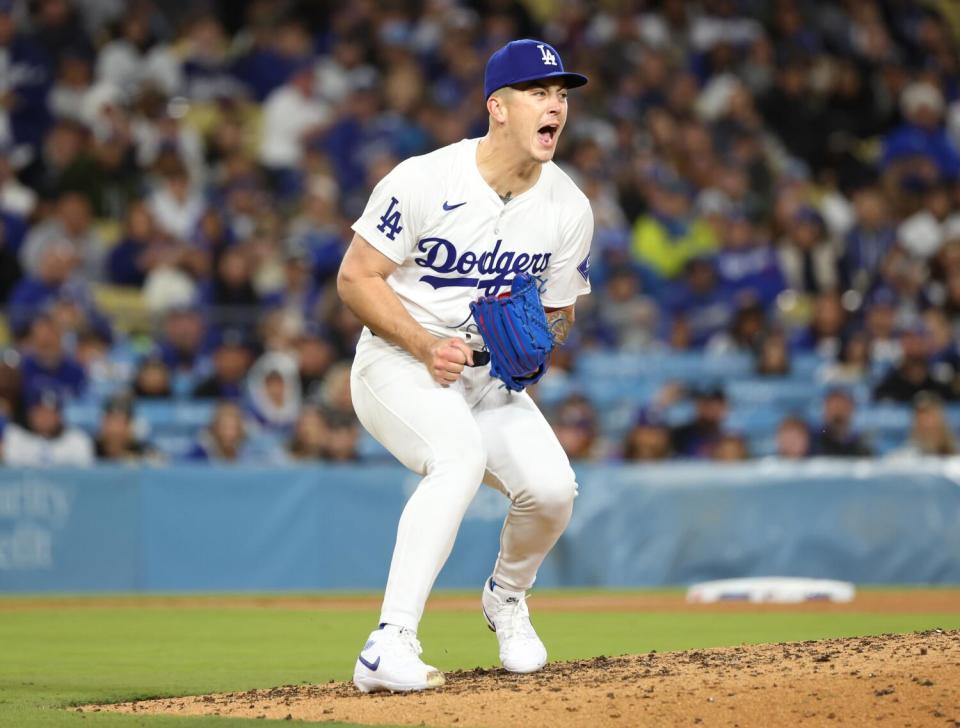 Dodgers pitcher Bobby Miller reacts after striking out his eleventh Cardinals batter.