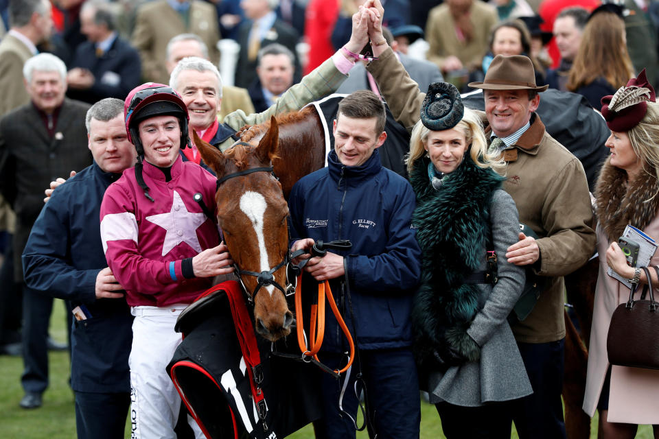 Jack Kennedy celebrates with owner Michael O’Leary and trainer Gordon Elliott after riding Samcro to victory in the Ballymore Novices’ Hurdle REUTERS/Darren Staples