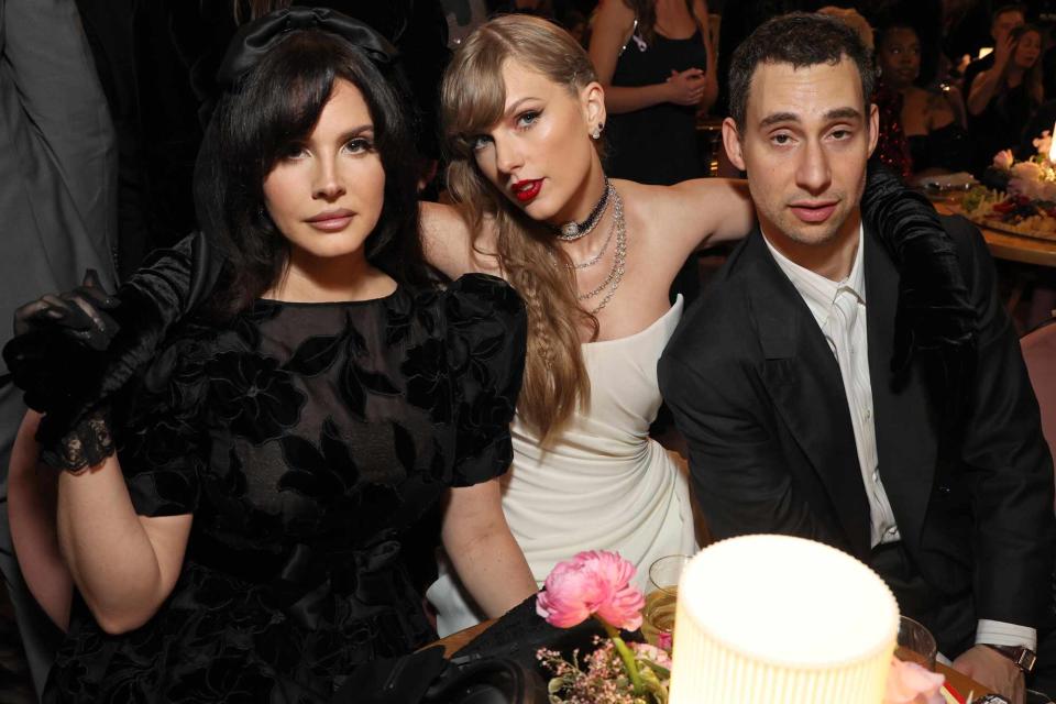 <p>Kevin Mazur/Getty </p> Lana Del Ray, Taylor Swift and Jack Antonoff at the 66th Grammy Awards 