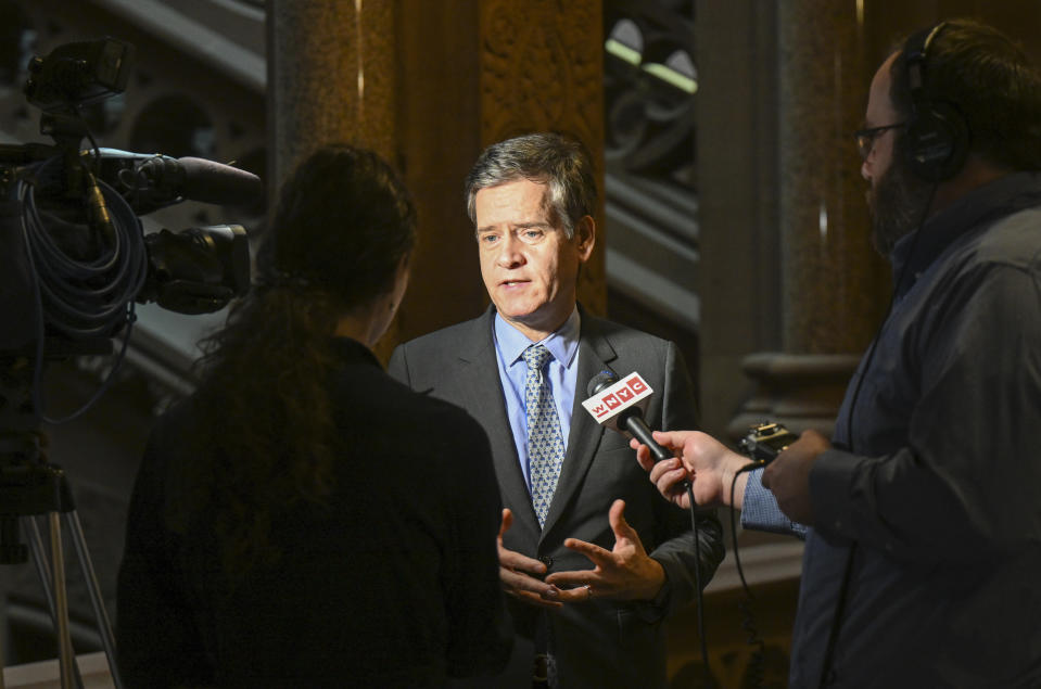 Sen. Brad Hoylman, D-New York, talks with reporters about legislation to approve a legislative pay raise and Gov. Hochul's nomination of Hector D. LaSalle, as the next Chief Judge of the New York State Court of Appeals during a special legislative session at the state Capito, Thursday, Dec. 22, 2022, in Albany, N.Y. (AP Photo/Hans Pennink)