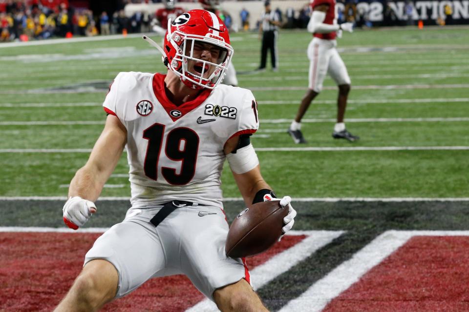 Georgia Bulldogs tight end Brock Bowers (19) celebrates after scoring a touchdown during the College Football Playoff National Championship against Alabama at Lucas Oil Stadium on Monday, Jan. 10, 2022, in Indianapolis. Georgia won 33-18.