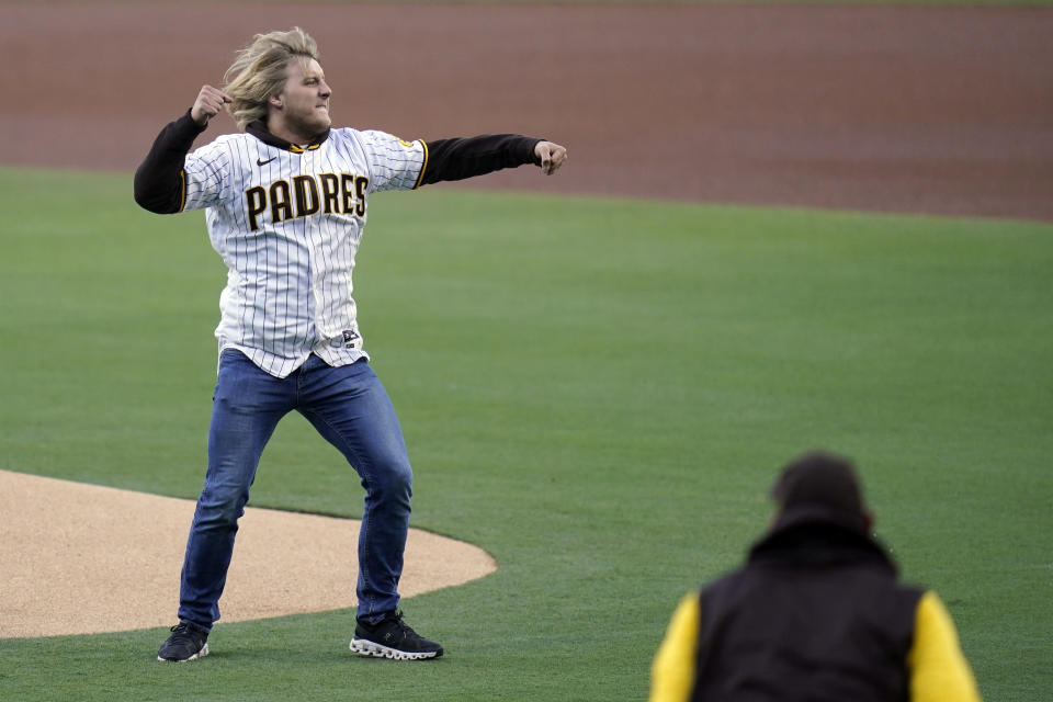 Mixed martial artist Paddy Pimblett reacts after throwing out a ceremonial first pitch before the San Diego Padres host the Chicago Cubs in a baseball game Tuesday, May 10, 2022, in San Diego. Pimblett fights in the Ultimate Fighting Championship (UFC) lightweight division. (AP Photo/Gregory Bull)