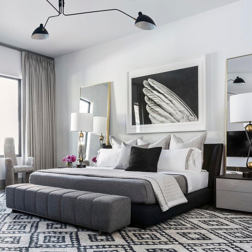 <p>There's no more fitting partner for a black and white room than a black and white photo. For this bedroom teed up by <a href="https://www.chairish.com/shop/benjamin-johnston-design" rel="nofollow noopener" target="_blank" data-ylk="slk:Benjamin Johnston Design;elm:context_link;itc:0;sec:content-canvas" class="link ">Benjamin Johnston Design</a>, an oversized photo over the bed lends a romantic edge. </p>