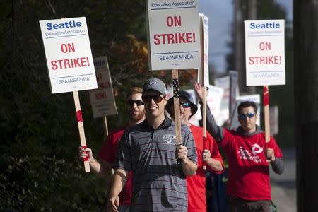 Teachers walk the picket line as they strike outside Roosevelt High School in Seattle, Washington September 9, 2015. REUTERS/Matt Mills McKnight