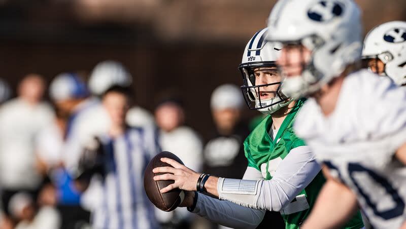 The BYU football team runs through drills during the first day of spring camp Feb. 29, 2024, in Provo.