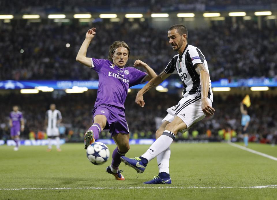<p>Juventus’ Leonardo Bonucci in action with Real Madrid’s Luka Modric </p>