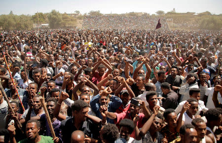 FILE PHOTO: Supporters of Bekele Gerba, secretary general of the Oromo Federalist Congress (OFC), chant slogans to celebrate Gerba's release from prison, in Adama, Oromia Region, Ethiopia February 14, 2018. REUTERS/Tiksa Negeri/File Photo