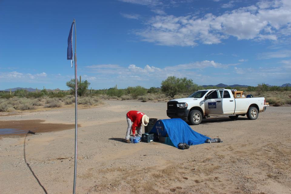 Tom Wingo, 76, refills water drums and gives water to migrants on the Organ Pipe Cactus National Monument west of Lukeville on Aug. 22, 2023.