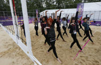 Dancers rehearse at the London 2012 Olympics beach volleyball venue in central London July 19, 2012. (REUTERS/Suzanne Plunkett)