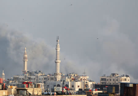 Smoke rises from Yarmouk Palestinian camp in Damascus, Syria April 19, 2018. REUTERS/Ali Hashisho