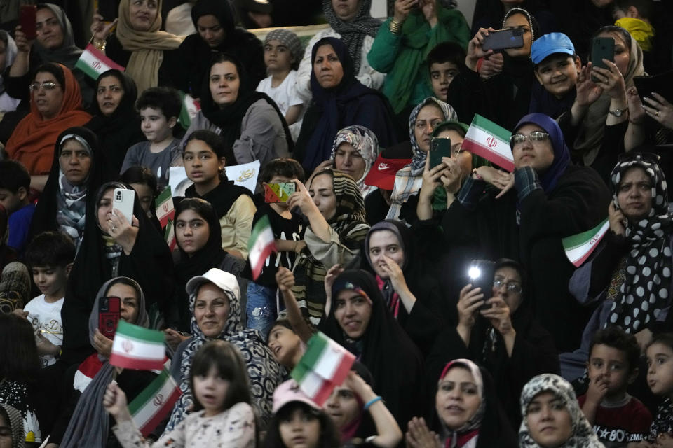 Supporters of Tehran Mayor Alireza Zakani, a candidate for the June 28 presidential election, attend his campaign rally in Tehran, Iran, Sunday, June 23, 2024. (AP Photo/Vahid Salemi)