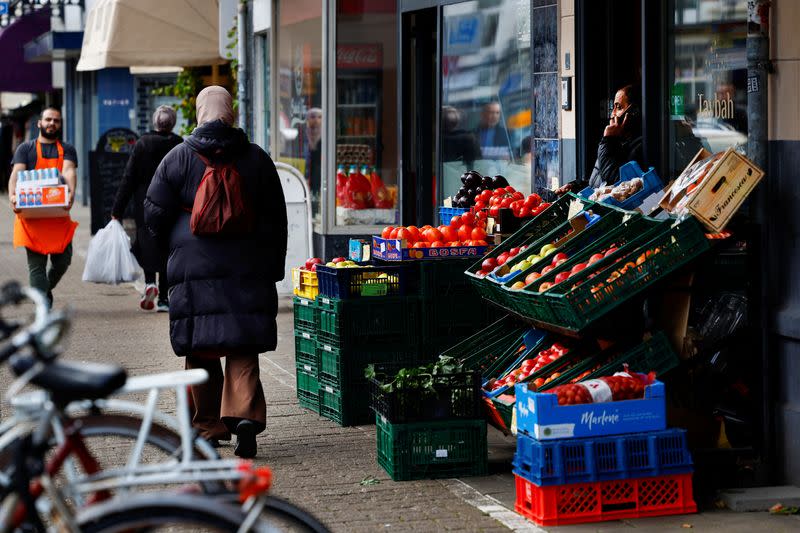 People walk past shops in Kanaleneiland, an immigrant-dominated area of Utrecht