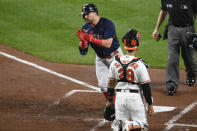 Boston Red Sox' Kyle Schwarber, top left, celebrates his home run during the second inning of a baseball game next to Baltimore Orioles catcher Pedro Severino (28), Tuesday, Sept. 28, 2021, in Baltimore. (AP Photo/Nick Wass)