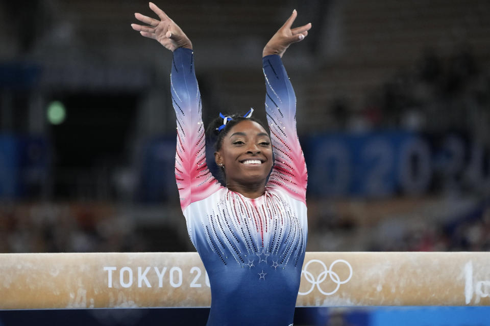 Simone Biles, of the United States, performs on the balance beam during the artistic gymnastics women's apparatus final finishes performs on the balance beam during the artistic gymnastics women's apparatus final at the 2020 Summer Olympics, Tuesday, Aug. 3, 2021, in Tokyo, Japan. (AP Photo/Ashley Landis)