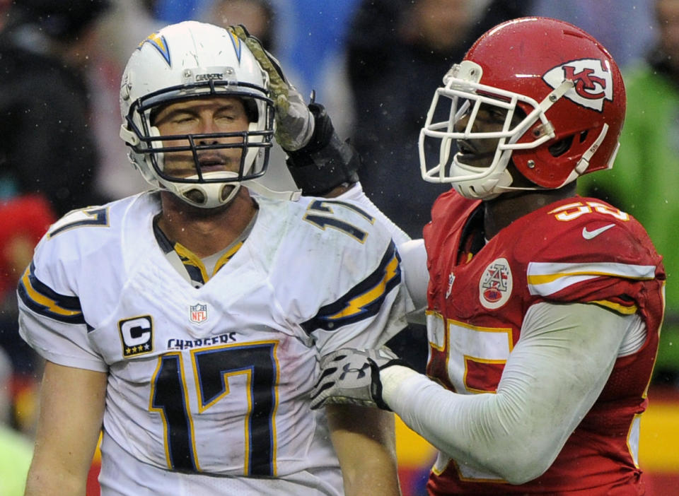 Kansas City Chiefs linebacker Dee Ford (55) pats San Diego Chargers quarterback Philip Rivers (17) on the helmet. (AP Photo/Ed Zurga)