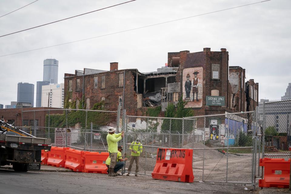 Workers shore up fencing around land Develop Detroit proposed as a mixed use project for a triangular piece of property bounded by Gratiot, Russell Street and Maple Street, site of the former Busy Bee Hardware warehouse, on Friday, Sept. 29, 2023. Six or seven years later, there has been no progress.