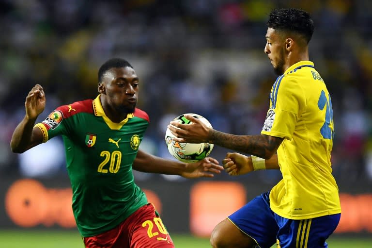 Cameroon's forward Karl Toko Ekambi (L) challenges Gabon's forward Denis Bouanga during the 2017 Africa Cup of Nations group A football match between Cameroon and Gabon at the Stade de l'Amitie Sino-Gabonaise in Libreville on January 22, 2017