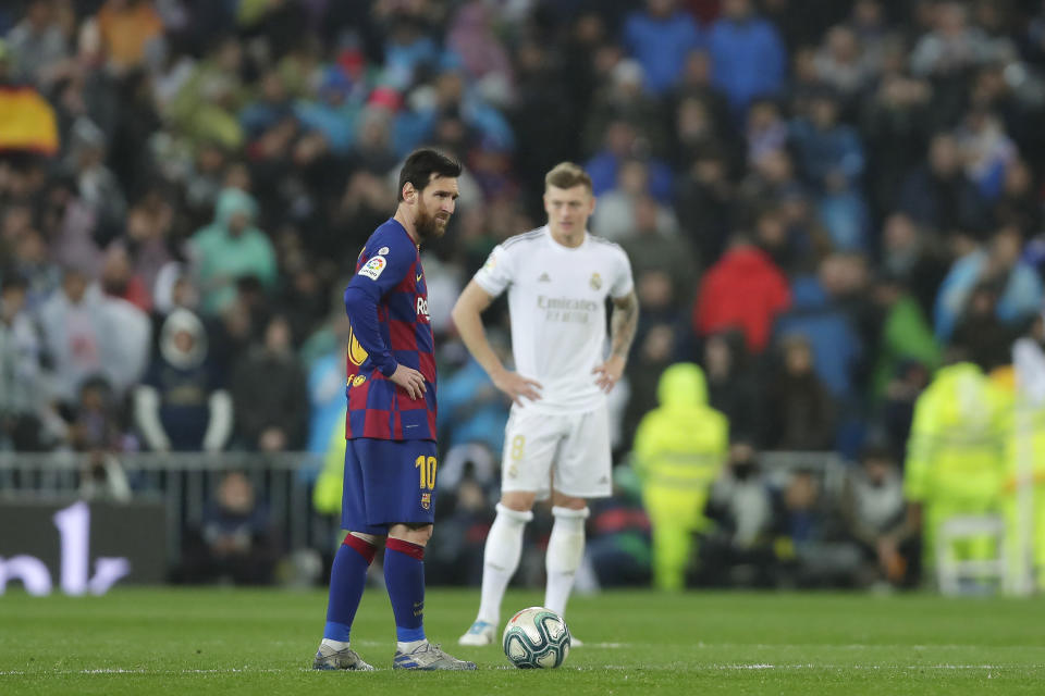 The La Liga title race between Real Madrid and Barcelona will be put on hold as the coronavirus spreads. (AP Photo/Manu Fernandez)
