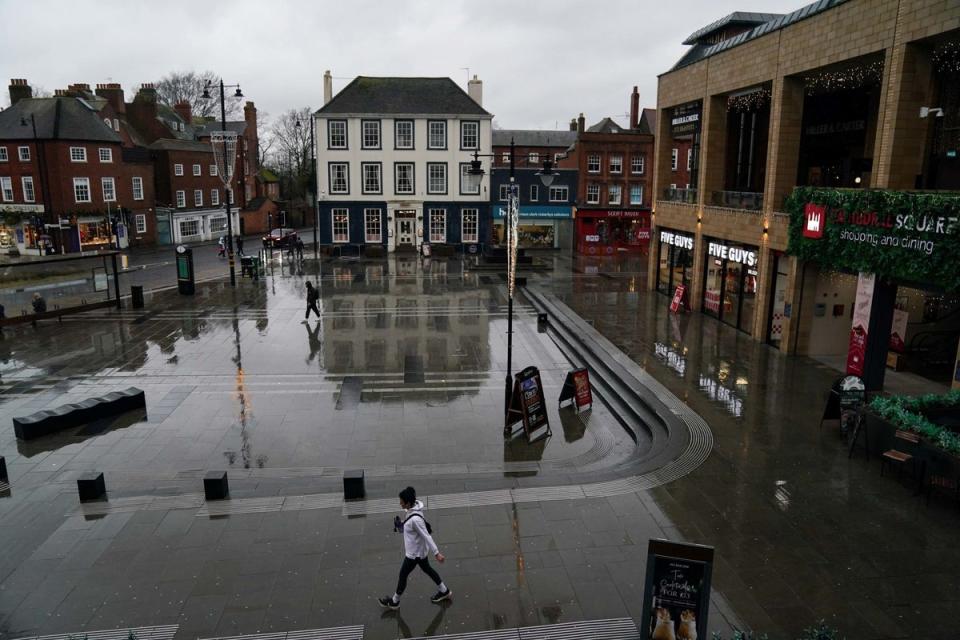 Shoppers on flooded Cathedral Square in Worcester (PA)