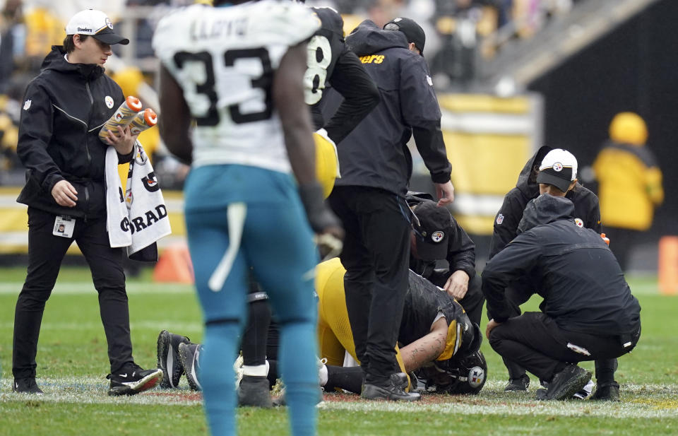 Pittsburgh Steelers quarterback Kenny Pickett, center, is helped after getting shaken up against the Jacksonville Jaguars during the first half of an NFL football game Sunday, Oct. 29, 2023, in Pittsburgh. (AP Photo/Matt Freed)