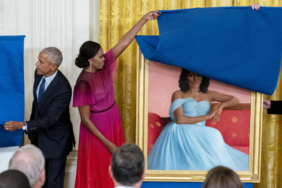 Former President Barack Obama and former first lady Michelle Obama unveil their official White House portraits during a ceremony in the East Room of the White House, Wednesday, Sept. 7, 2022, in Washington. (AP Photo/Andrew Harnik)