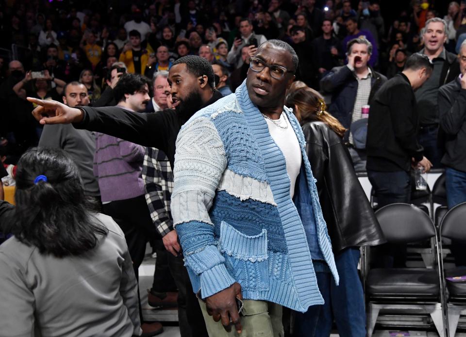 Shannon Sharpe is restrained by security after a verbal altercation during halftime of the Grizzlies-Lakers game on January 20, 2023, in Los Angeles, California.