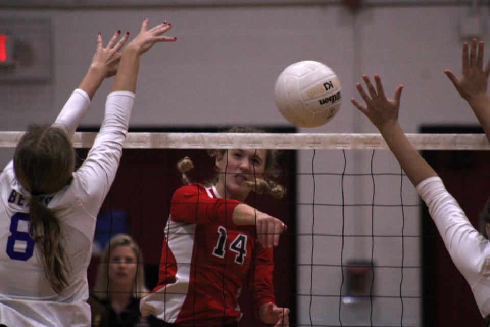 Bishop Kenny's Claudia Stockard (14) spikes the ball against Bartram Trail.