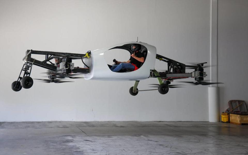 On Monday, July 3, 2023 Doroni Aerospace CEO Doron Merdinger gives a thumbs up as he levitates in the latest version of his company’s flying car at Doroni Aerospace’s Pompano Beach offices.