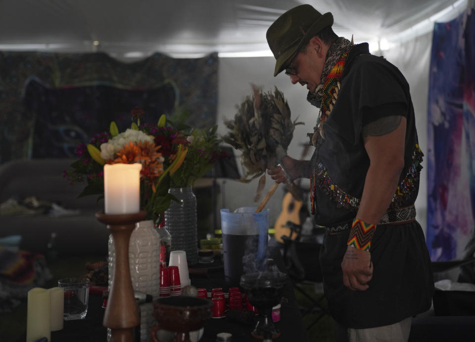 Colombian shaman Taita Pedro Davila, leads an ayahuasca ceremony with Hummingbird Church, in Hildale, Utah, on Sunday, Oct. 16, 2022. Following the traditions of his grandfather in Colombia, Davila prays, chants, and sings in Spanish and the language of the Kamëntsá people over the psychoactive brew before serving it to individual participants. (AP Photo/Jessie Wardarski)