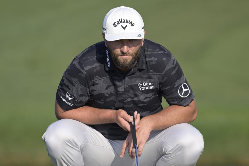 Jon Rahm, of Spain, lines up a putt on the 13th green during the second round of the Arnold Palmer Invitational golf tournament, Friday, March 3, 2023, in Orlando, Fla. (AP Photo/Phelan M. Ebenhack)