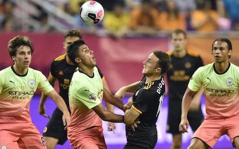 Rodri (centre left) vies for the ball - Credit: afp