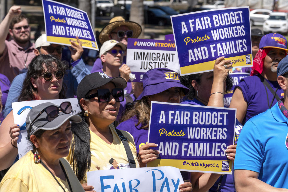 Members of the Service Employees International Union and their supporters rally against proposed budget cuts to state provided social safety net programs, in Sacramento, Calif., Tuesday, June 11, 2024. The California Legislature on Thursday, June 13, rejected many of Gov. Gavin Newsom's most difficult budget cuts, choosing instead to speed-up a temporary tax increase on some businesses to help pay off an estimated $45 billion deficit while preserving spending on many social safety net programs.(AP Photo/Rich Pedroncelli)