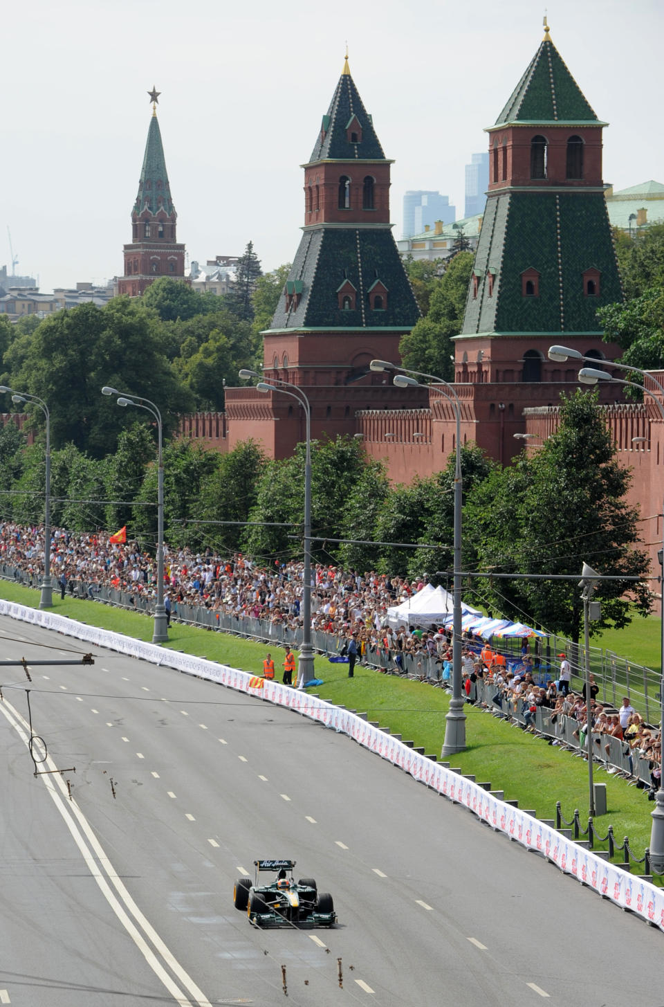 Formula One Team Lotus driver Karun Chandhok of India drives past Kremlin during the "Moscow City Racing" show on July 17, 2011 in central Moscow. AFP PHOTO / NATALIA KOLESNIKOVA (Photo credit should read NATALIA KOLESNIKOVA/AFP/Getty Images)