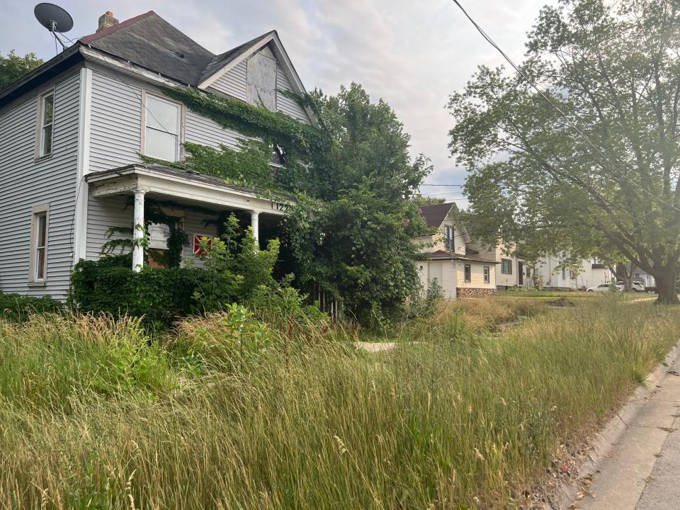 Boarded-up houses, like this one seen Tuesday, July 11, 2023, in the 1200 block of 10th Avenue in Rockford, are just an example of how blight takes its toll on neighborhoods, said Rockford resident Eli Durante. The body of 10-year-old homicide victim Destiny Huggins was discovered Saturday, July 8, 2023, on the other side of this home.