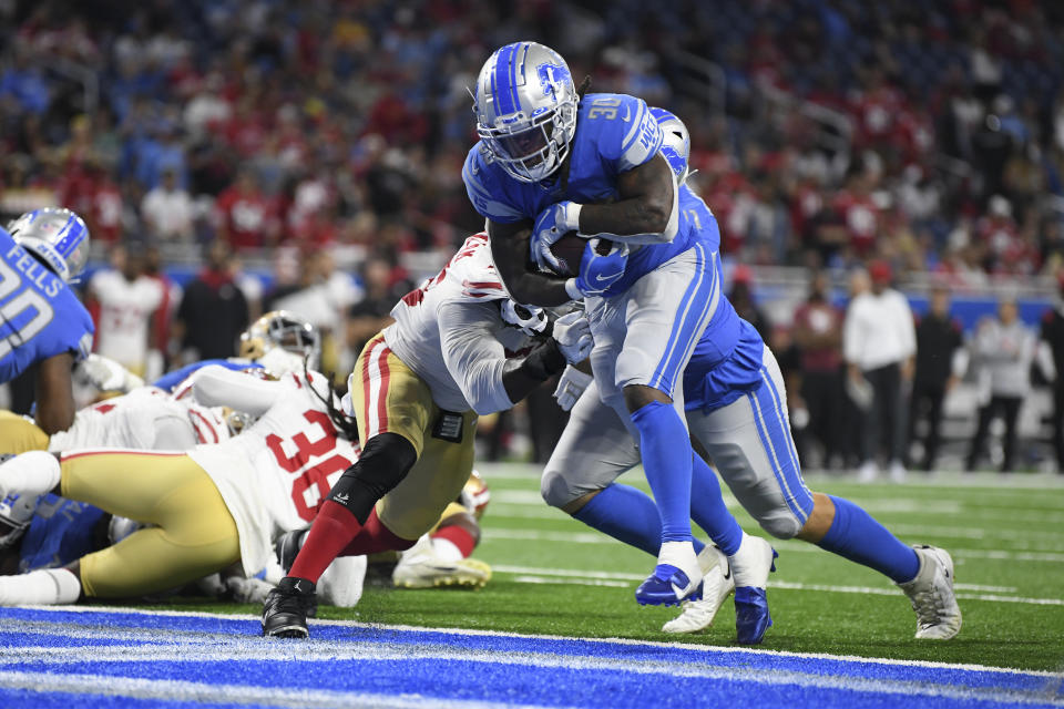 Detroit Lions running back Jamaal Williams (30) runs for a one-yard touchdown against the San Francisco 49ers in the second half of an NFL football game in Detroit, Sunday, Sept. 12, 2021. (AP Photo/Lon Horwedel)