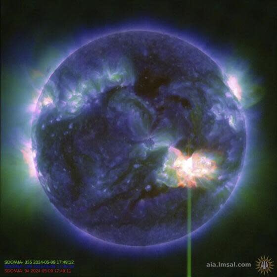 This image provided by NASA shows a solar flare, as seen in the bright flash in the lower right, captured by NASA's Solar Dynamics Observatory on May 9, 2024. A severe geomagnetic storm watch has been issued for Earth starting Friday and lasting all weekend _ the first in nearly 20 years. (NASA/SDO via AP)