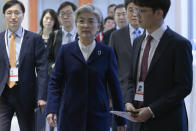 South Korea's Foreign Minister Kang Kyung-wha, center, arrives at a trilateral meeting with U.S. Secretary of State Mike Pompeo and Japan's Foreign Minister Toshimitsu Motegi during the 56th Munich Security Conference (MSC) in Munich, southern Germany Saturday, Feb. 15, 2020. (Andrew Caballero-Reynolds/Pool Photo via AP)