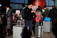 Travellers arrive at Beijing Capital International Airport