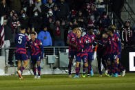 United States' Antonee Robinson (5) celebrates his goal with Tyler Adams (4) and teammates during the second half of a FIFA World Cup qualifying soccer match against El Salvador, Thursday, Jan. 27, 2022, in Columbus, Ohio. (AP Photo/Julio Cortez)