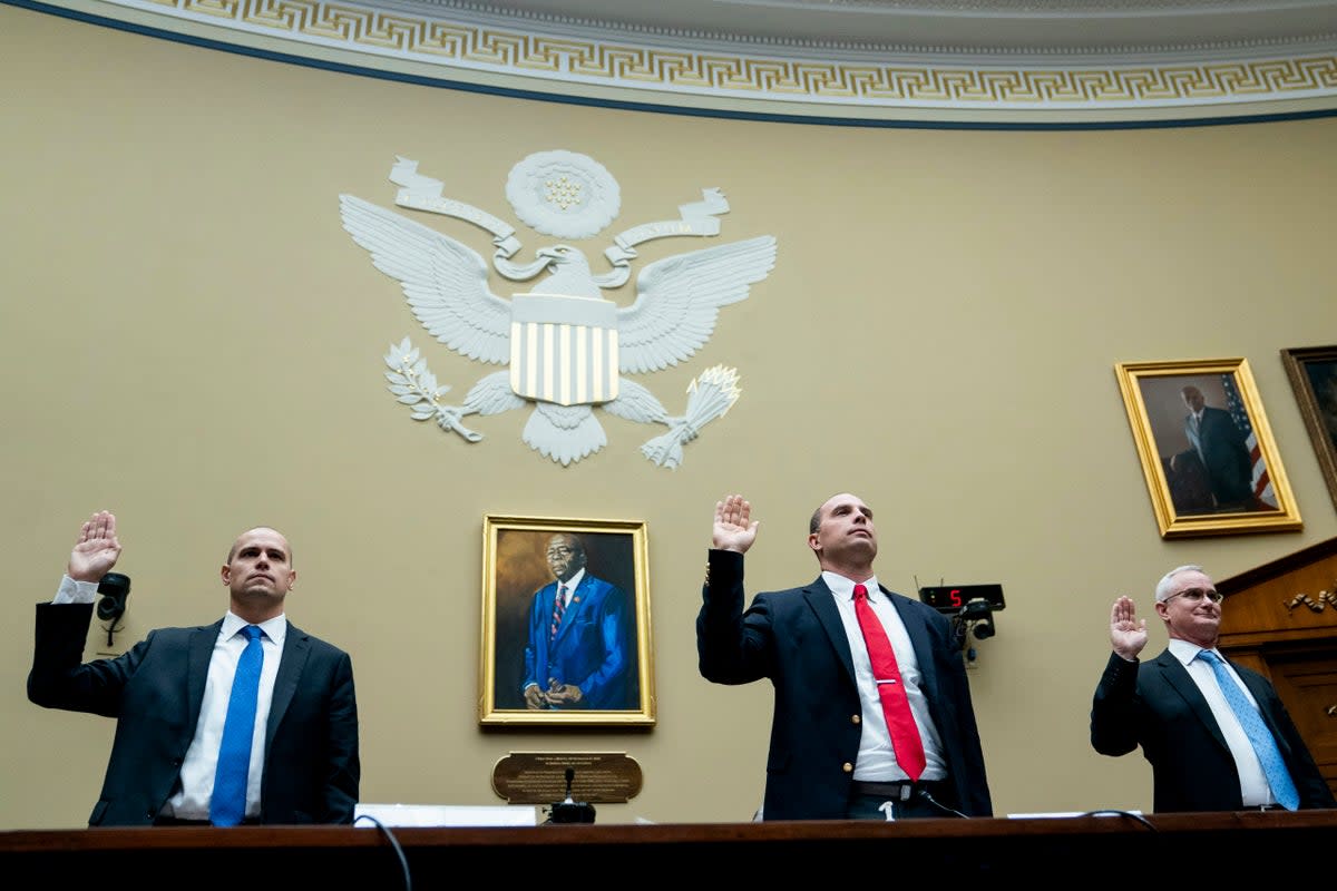 Ryan Graves, Americans for Safe Aerospace Executive Director, from left, U.S. Air Force (Ret.) Maj. David Grusch, and U.S. Navy (Ret.) Cmdr. David Fravor, are sworn in during a House Oversight and Accountability subcommittee hearing on UFOs, Wednesday, July 26, 2023, on Capitol Hill in Washington.  (Copyright 2023 The Associated Press. All rights reserved.)