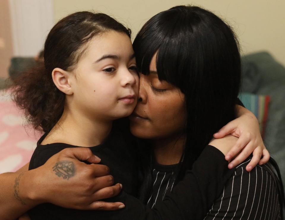 Kendra Smith embraces her daughter Diamond Yeno at their home in Poughkeepsie on January 28. Kendra's life has been deeply impacted by gun violence and loss, but she has overcome her challenges and works every day to protect her daughter from experiencing similar loss.