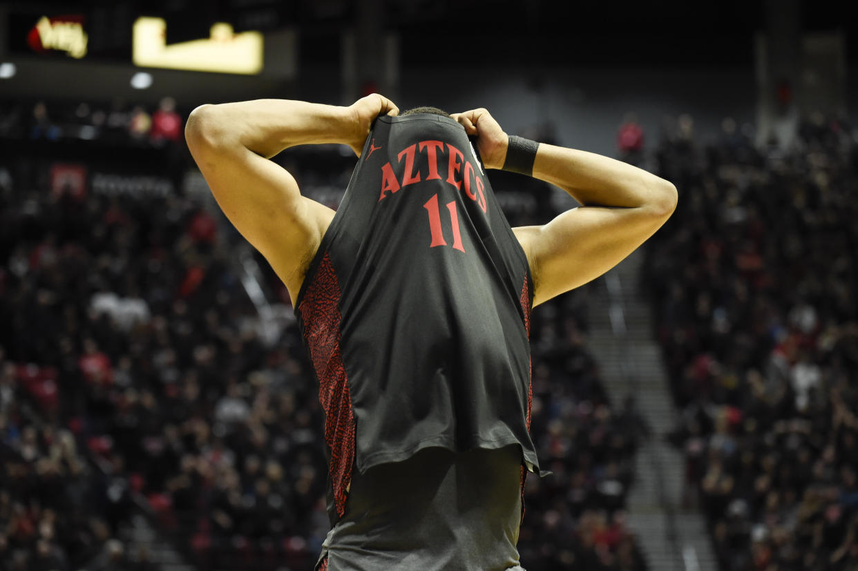 San Diego State forward Matt Mitchell (11) covers his face after missing a final basket in the Aztecs' loss to UNLV on Saturday, their first of the year