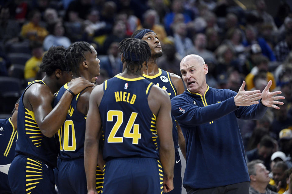 Indiana Pacers head coach Rick Carlisle talks with his team during the second quarter of an NBA Basketball game against the New Orleans Pelicans, Monday, Nov. 7, 2022, in Indianapolis, Ind. (AP Photo/Marc Lebryk)