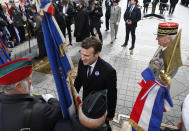 <p>French president-elect Emmanuel Macron, center, greets veterans during a ceremony to mark Victory Day in Paris, France, Monday, May 8, 2017. French president-elect Emmanuel Macron, will appear Monday alongside current President Francois Hollande in commemoration of the end of World War II. Monday, a national holiday, marks the day of the formal German defeat in World War II. (Francois Mori, Pool via AP) </p>