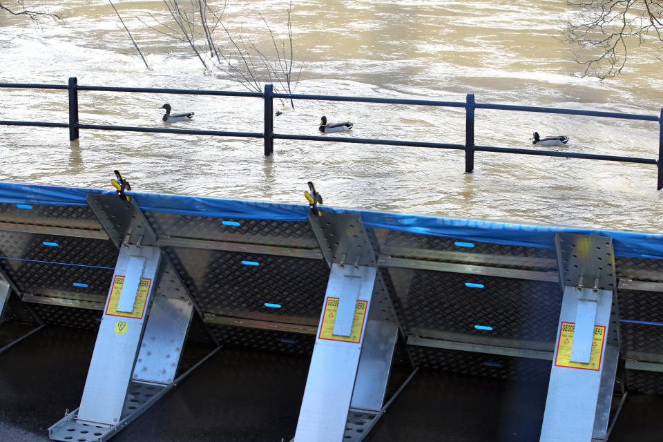 Temporary flood barriers on the Wharfage in Ironbridge, Shropshire, as the River Severn remains high, with warnings of further flooding across the UK. See PA story WEATHER Storm. Photo credit should read: Nick Potts/PA Wire